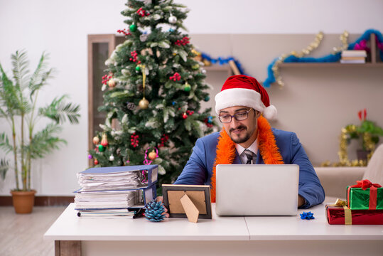 Young businessman working from home at Christmas eve