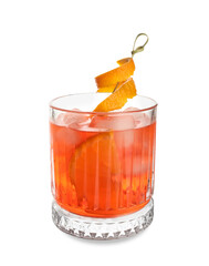 Glass of negroni cocktail with orange peel on white background
