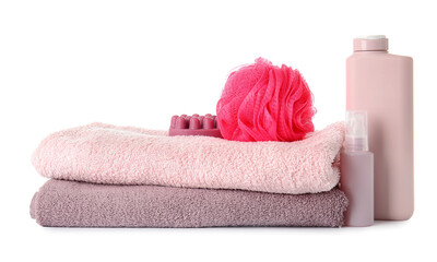 Obraz na płótnie Canvas Cosmetic products, towels and bath sponge on white background