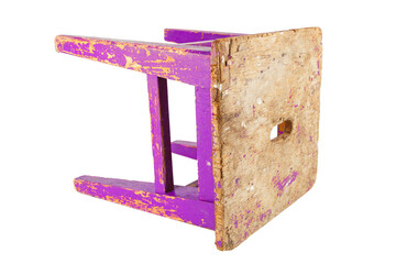 Old wooden stool with peeling pink paint. Loft style chair isolated on a white background.