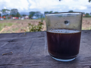 A cup of black coffee on a cold morning