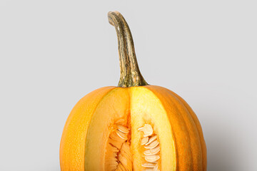 Ripe cut pumpkin on light background