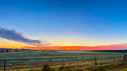 Obraz na płótnie Canvas sunset over pasture