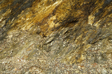 Clastic Sedimentary rock has the original texture of sediments such as sand, rubble and soil.