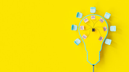 Conference table looks like yellow light bulb. Several pink laptop on top table on yellow background. Minimal idea concept, 3D Render.