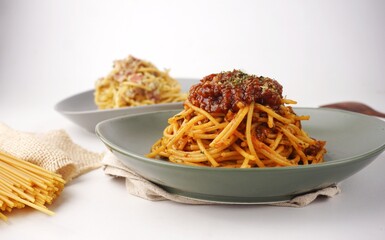 Delicious spaghetti served on a plate with blurred background