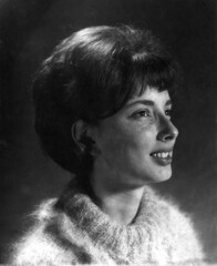 Black and white profile photo of a young woman, a college coed, looking ahead to her future