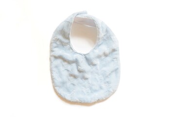 Newborn baby clothing on white background,Baby bibs,apron,napkin Top view, flat lay.
