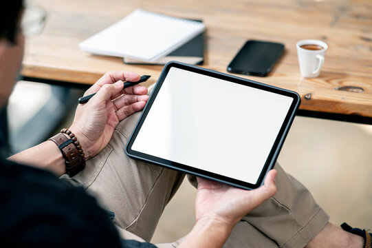 man hand using portable tablet at cafe room. - Powered by Adobe