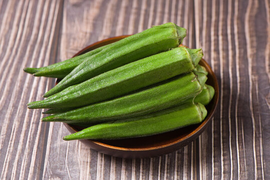 Fresh okra vegetable on wood backgroud