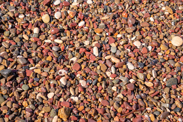 Variety of colorful pebbles at Nisporto beach Island of Elba Italy