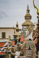 Fototapeta na wymiar Giant statue at the grand palace the Temple of the Emerald Buddha. 