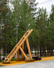Original wooden structures in the central park of the city of Noyabrsk in summer