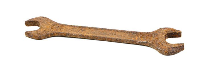 Old rusty wrench on a white background