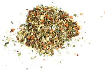 A mixture of seasonings scattered on a white background