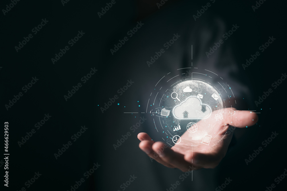 Leinwandbilder Hand holding virtual cloud computing with world and technology items like uploading and downloading. Business strategy and customer service of cloud technology management big data.