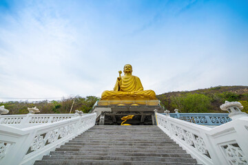 Fototapeta na wymiar View of Golden Buddha statue at Chon Khong Monastery in Vung tau city.