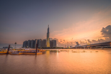 Fototapeta premium The Landmark 81 - a super-tall skyscraper of Vinhomes Central Park Project, viewed from Binh An waterbus station, Ho Chi Minh city, Vietnam