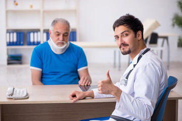 Fototapeta premium Old neck injured male patient visiting young male doctor
