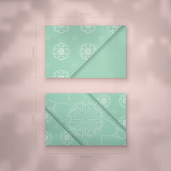 Mint color business card with abstract white ornament for your brand.