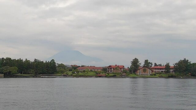 From shore of Lake Kivu in Goma, Mt Nyiragongo volcano in distance