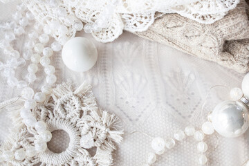 Beautiful delicate white christmas background with beads, balls, new year decor