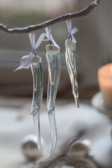 Dichroic glass icicles hanging on a branch, handmade in fusing technique, beautiful christmas decor