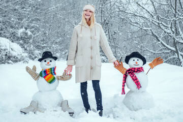 Winter woman. Funny Girl Love winter. Winter portrait of young woman in the winter snowy scenery....