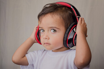 portrait of little boy with big headphones