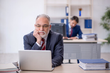 Two male colleagues working in the office