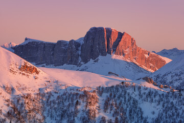 Mountain range in the rays of the winter setting sun