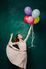 cheerful woman with colorful balloons birthday fun