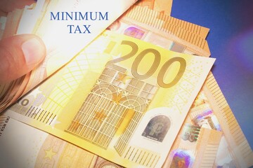 Hand with euro banknotes and the text 