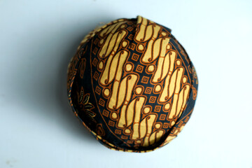Blangkon or Javanese men's traditional hat on a white background