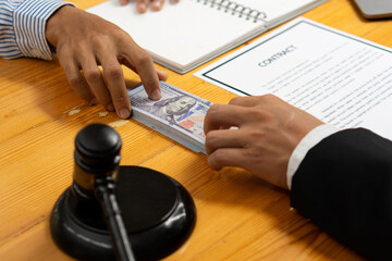 When the court receives money from the businessman in exchange for help The unfair judgment is...