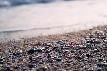 Pebbles on the sea beach. Background and texture. Travel and adventure.