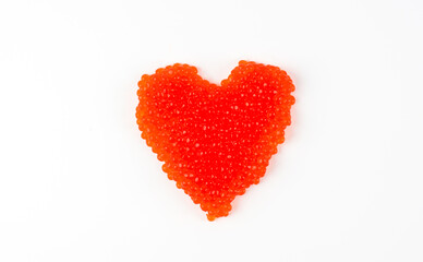 Heart shaped red caviar isolated on white background. Sandwich in the form of a heart on a white background. big heart from the red caviar over white. valentine red caviar heart isolated on white