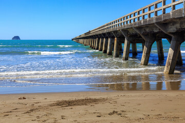 The historic wharf at Tolaga Bay, New Zealand. Built in 1929, it is the longest in the country