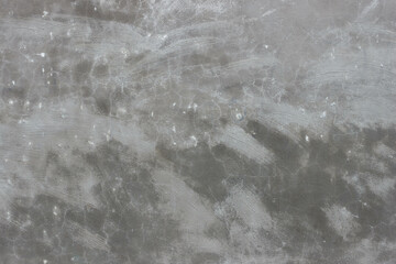 Beautiful gray texture with dark spots. Brush marks on wall. 
