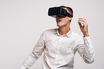 portrait of a man in a white shirt vr glasses gadget device video technology studio