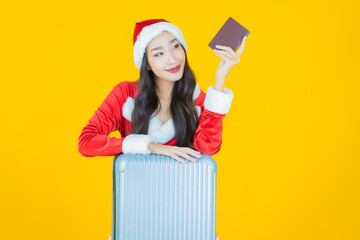 Portrait young asian woman wear christmas costume with action on yellow background