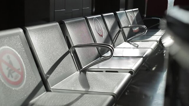 Close-up photo of stainless steel chairs installed in a public area for the client of a veterinary hospital.