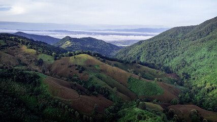 Fototapeta premium Landscape of Doi Sakad mountain valley in Pua, Nan Province, Thailand during rainy season. Photo from aerial view by drone