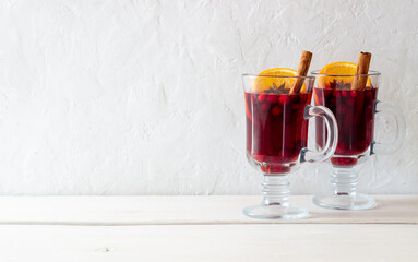 Mulled wine with cinnamon, cranberry and orange. Hot drink. Winter.