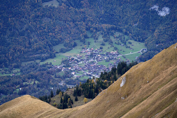 Fototapeta na wymiar Aerial view of village at Hasli valley at Bernese Highlands seen from Axalp on a grey cloudy autumn day. Photo taken October 19th, 2021, Brienz, Switzerland.
