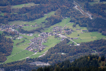 Fototapeta na wymiar Aerial view of village at Hasli valley at Bernese Highlands seen from Axalp on a grey cloudy autumn day. Photo taken October 19th, 2021, Brienz, Switzerland.