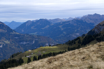 Fototapeta premium Mountain panorama seen from Axalp at Bernese Highlands on a grey cloudy autumn day. Photo taken October 19th, 2021, Brienz, Switzerland.