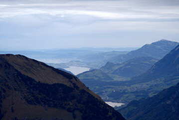 Naklejka premium Mountain panorama seen from Axalp at Bernese Highlands on a grey cloudy autumn day. Photo taken October 19th, 2021, Brienz, Switzerland.