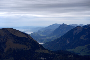Obraz na płótnie Canvas Mountain panorama seen from Axalp at Bernese Highlands on a grey cloudy autumn day. Photo taken October 19th, 2021, Brienz, Switzerland.