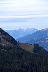 Obraz premium Mountain panorama seen from Axalp at Bernese Highlands on a grey cloudy autumn day. Photo taken October 19th, 2021, Brienz, Switzerland.